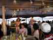Some live on-board entertainment.  At one point during the cruise, the singer singled out Soo from the crowd and asked her what her name and my name was.  Then the guy composed a song about US right on the spot and sang it in front of everyone!
